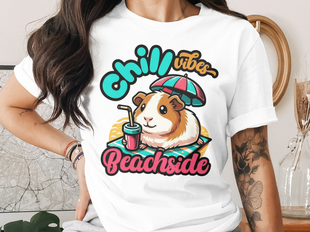 Guinea pig wearing sunglasses, enjoying a drink with "Chill Vibes Beachside" text.