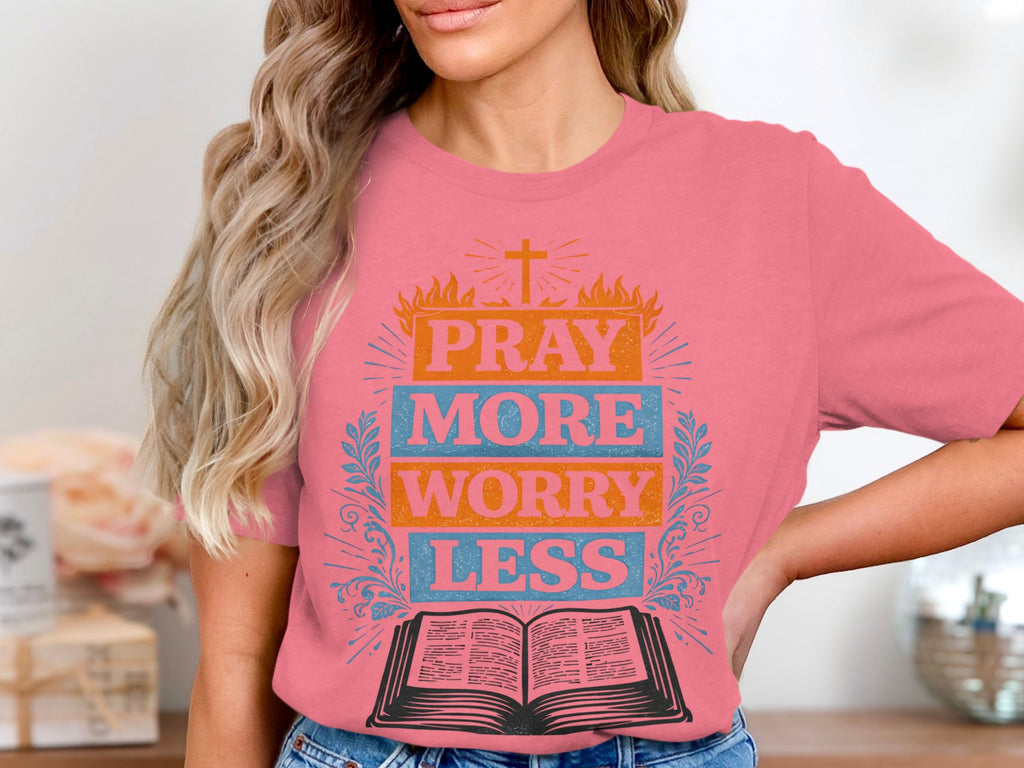 Pink t-shirt with "PRAY MORE WORRY LESS" and an open bible graphic.