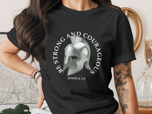 Black t-shirt with a Roman helmet graphic and text "BE STRONG AND COURAGEOUS JOSHUA 1:9".