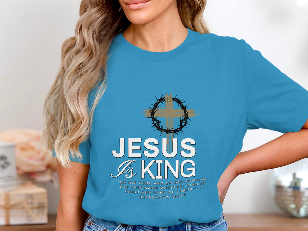 Blue t-shirt with "Jesus is King" text and Bible verse from Revelation.