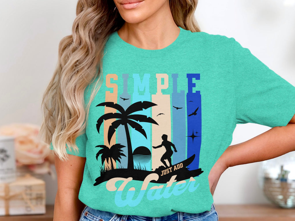 Turquoise t-shirt with surfing graphic and "SIMPLE JUST ADD WATER" text.