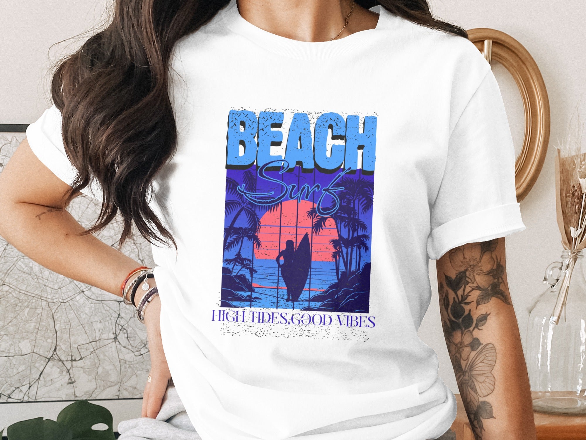 T-shirt with "BEACH SURF" graphic, sunset, palm trees, and surfboard.