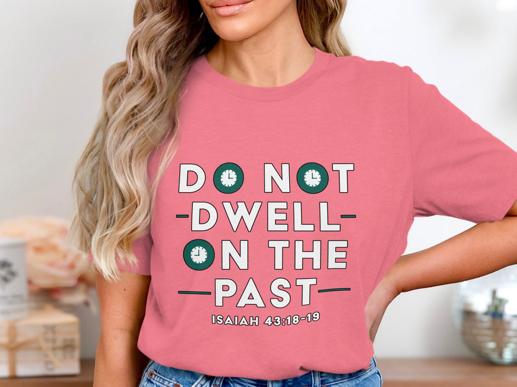 Pink t-shirt with "Do Not Dwell On The Past" and "Isaiah 43:18-19" in white text.